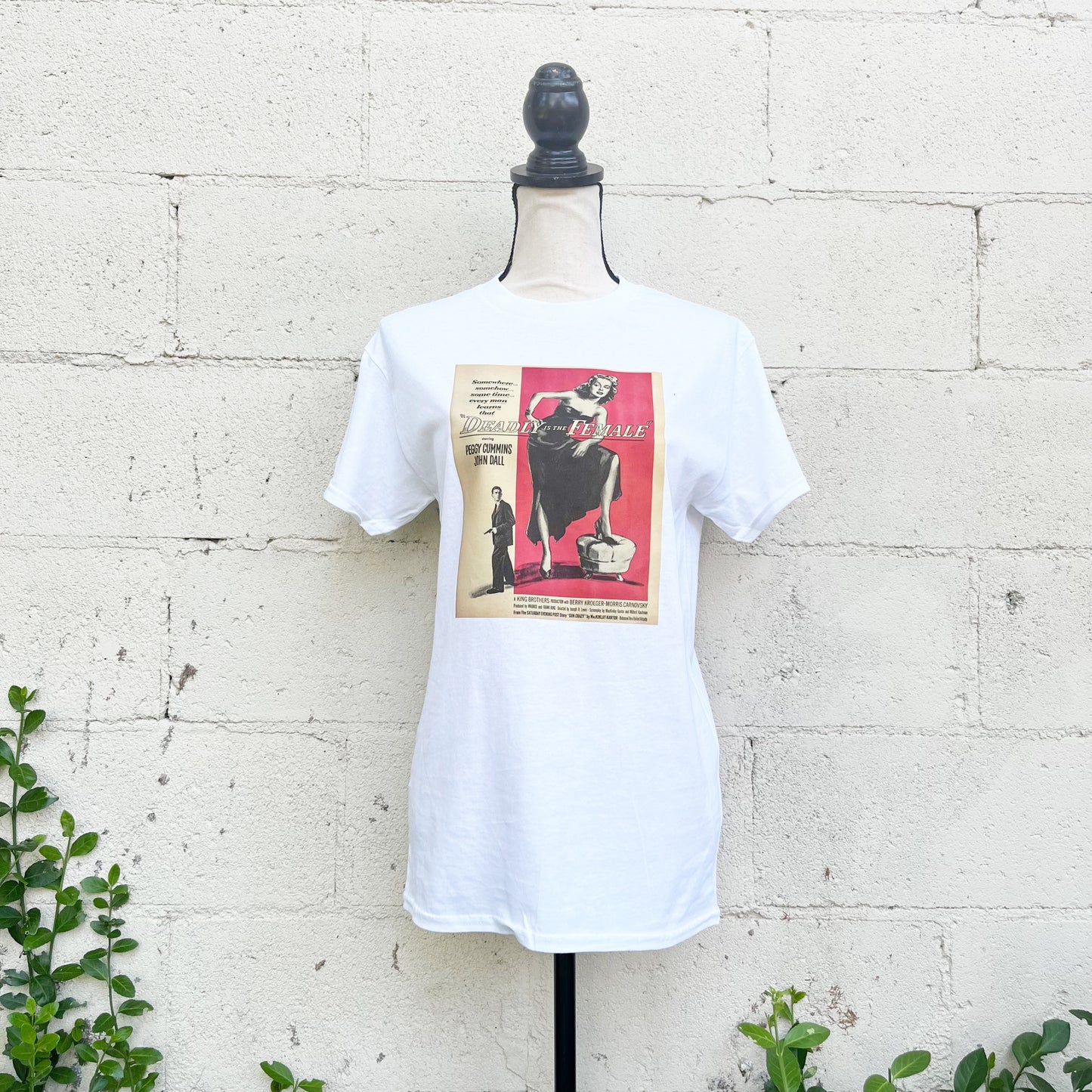 Step into nostalgia with our hand-curated Deadly is the Female movie poster retro printed 100% cotton white t-shirts