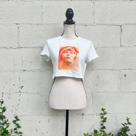 Elevate your style with our unique 1 of 1 curated retro printed tee - wearable art designed exclusively for you. This is a 100% cotton cropped tee that has been decorated with a retro 1920's flappers print. Size XS.